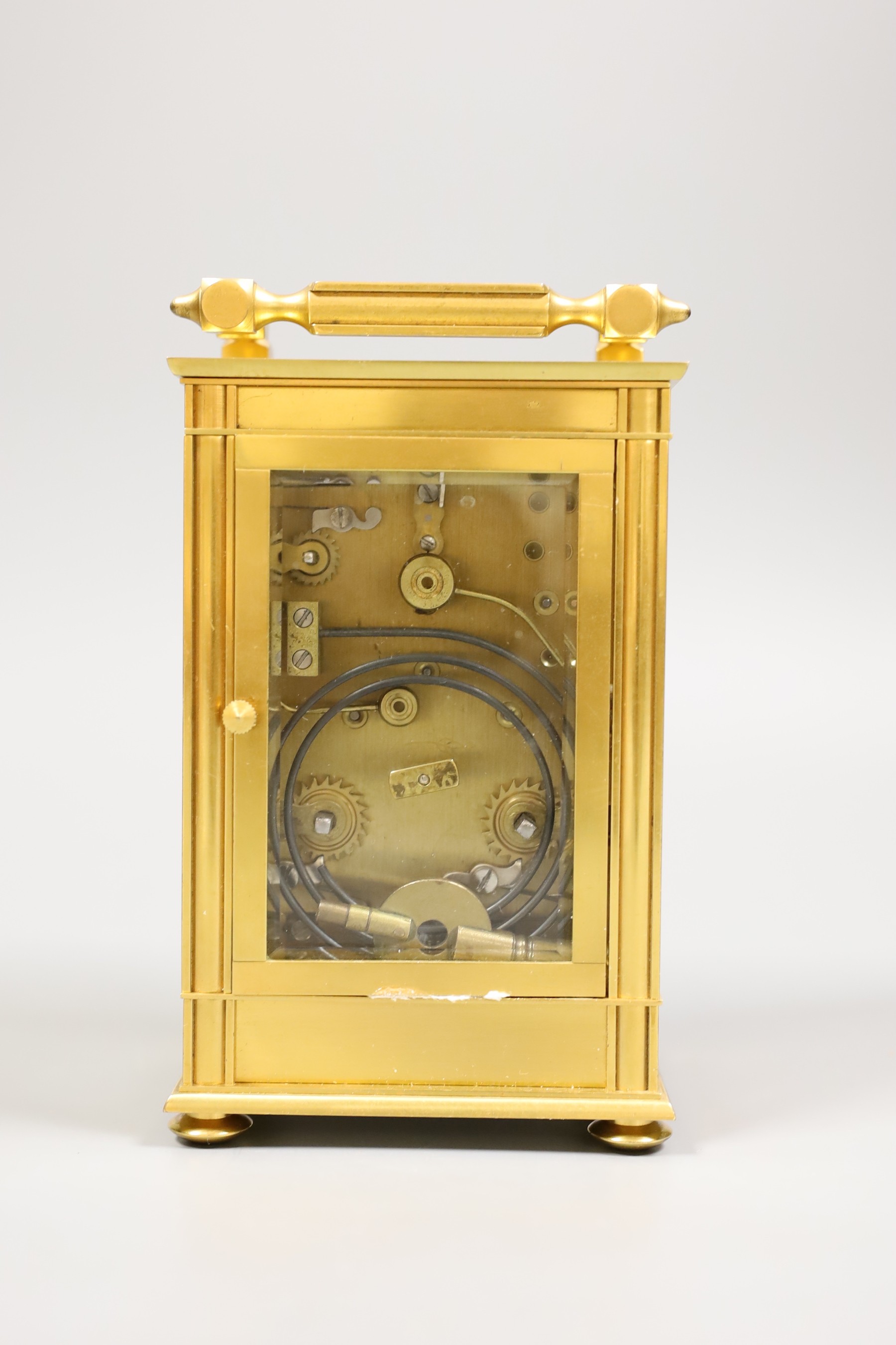 A French repeating carriage clock with alarm and with inlaid scroll decoration, with key, 19cm tall